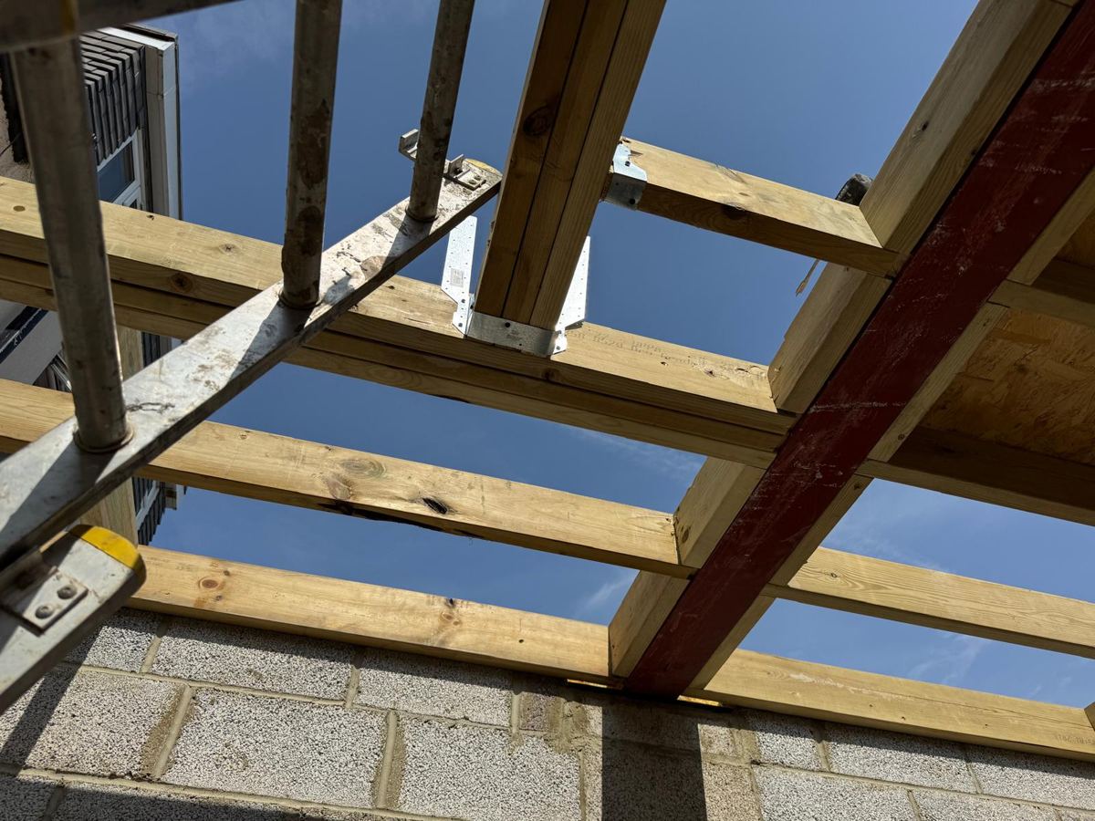 New joists and hangers over the blockwork shell